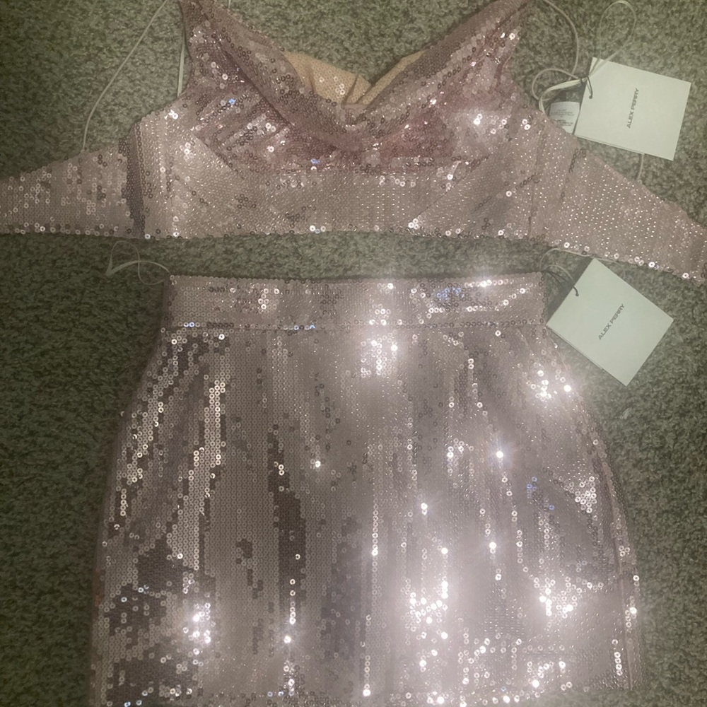 Worn once. Tags are no longer on the outfit.
